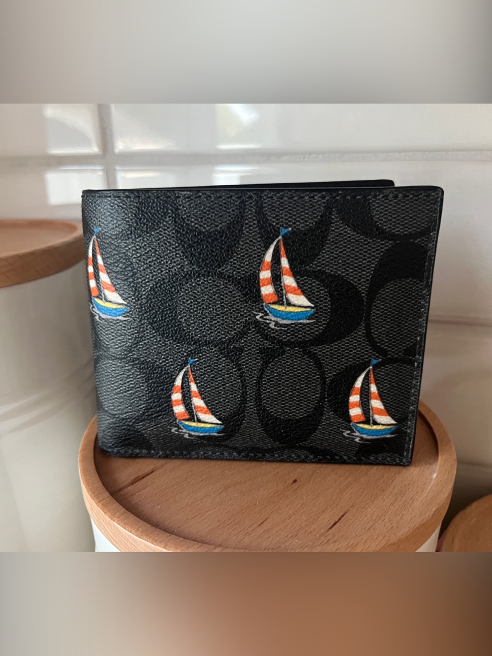 Coach Black Signature Canvas Men’s Bifold Wallet with Colorful Sailboat Motif